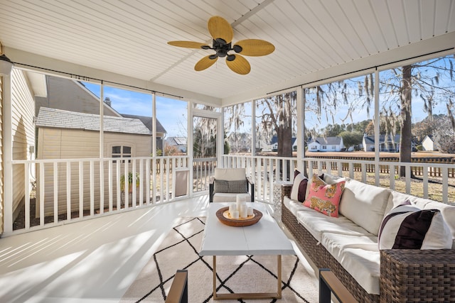 sunroom / solarium with ceiling fan