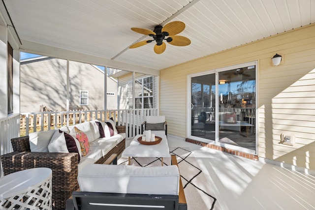 sunroom / solarium with a wealth of natural light and ceiling fan