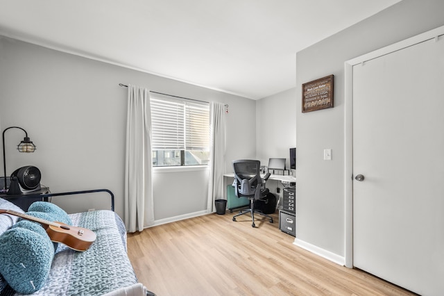 1530 Fort Johnson Rd Unit 1L, Charleston, SC 29412 - bedroom featuring light wood-style floors, a desk, and baseboards