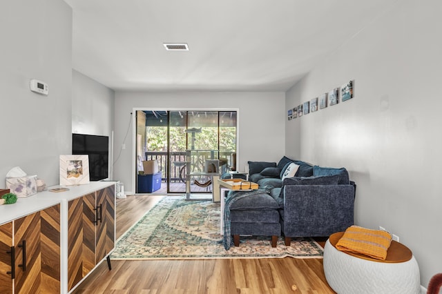 1530 Fort Johnson Rd Unit 1L, Charleston, SC 29412 - living room featuring wood finished floors
