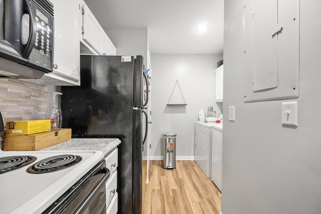 1530 Fort Johnson Rd Unit 1L, Charleston, SC 29412 - kitchen with black microwave, light wood-type flooring, white cabinets, light countertops, and tasteful backsplash