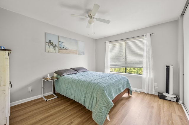 1530 Fort Johnson Rd Unit 1L, Charleston, SC 29412 - bedroom featuring wood finished floors, baseboards, and a ceiling fan