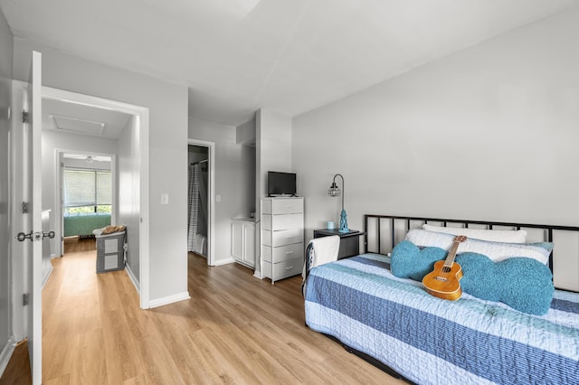 1530 Fort Johnson Rd Unit 1L, Charleston, SC 29412 - bedroom with light wood-style floors, attic access, and baseboards