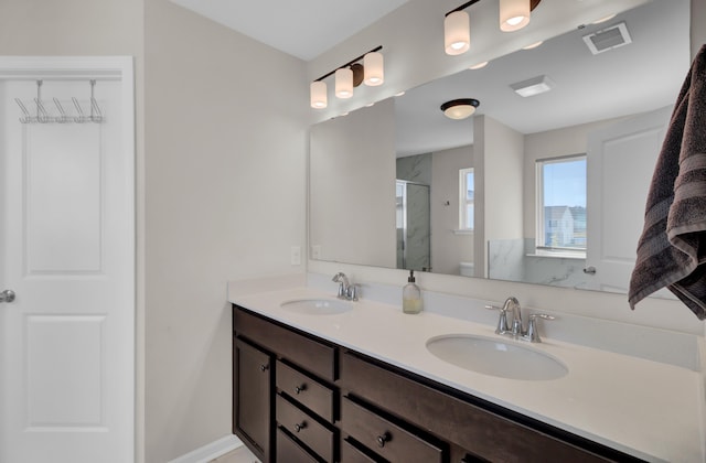 bathroom featuring toilet, vanity, and walk in shower