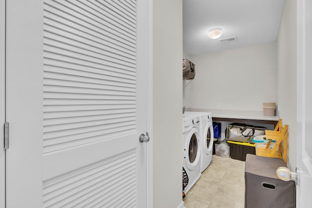 washroom featuring independent washer and dryer