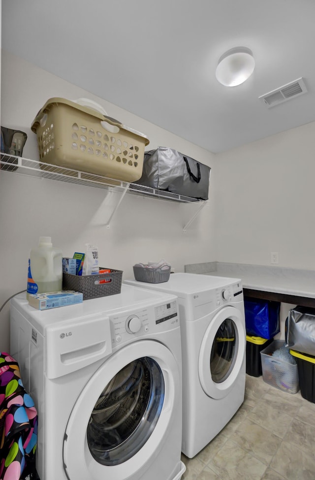 laundry area featuring separate washer and dryer