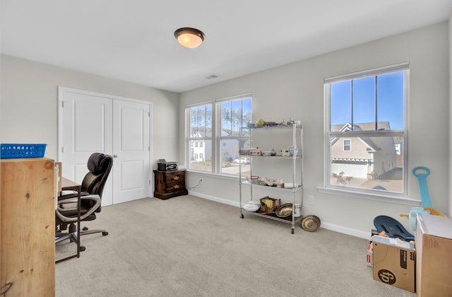 office area featuring light colored carpet