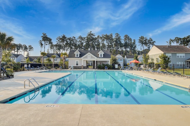 view of swimming pool with a patio area