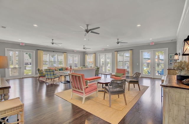 living room featuring plenty of natural light, ceiling fan, and french doors