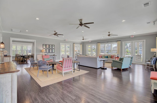 living room featuring dark hardwood / wood-style floors, ceiling fan, crown molding, and french doors