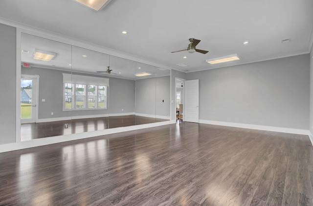 spare room with dark hardwood / wood-style floors, ceiling fan, and crown molding