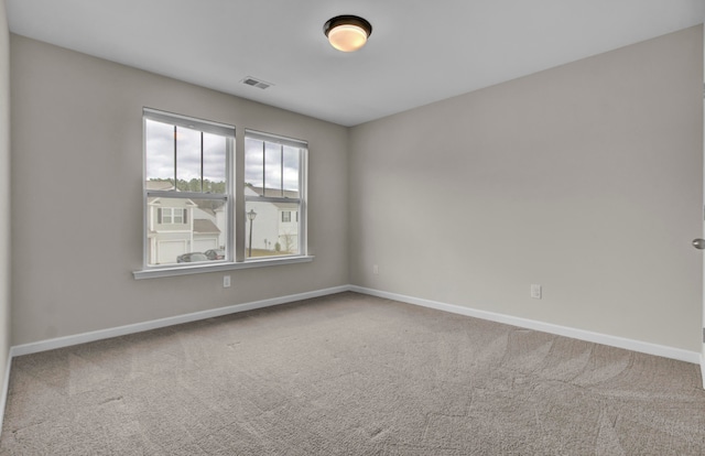 unfurnished room with carpet floors