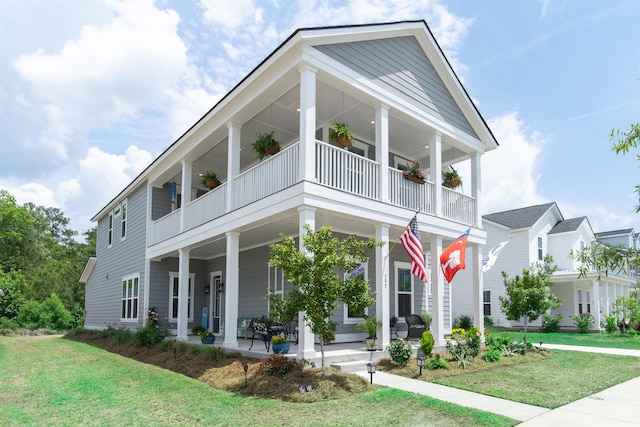 397 Woodgate Way, Summerville, SC 29485 - neoclassical home with covered porch, a front lawn, and a balcony