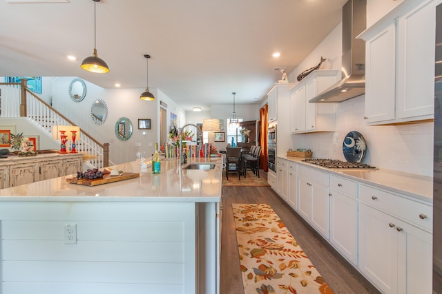 397 Woodgate Way, Summerville, SC 29485 - kitchen featuring wall chimney range hood, white cabinets, appliances with stainless steel finishes, and a sink