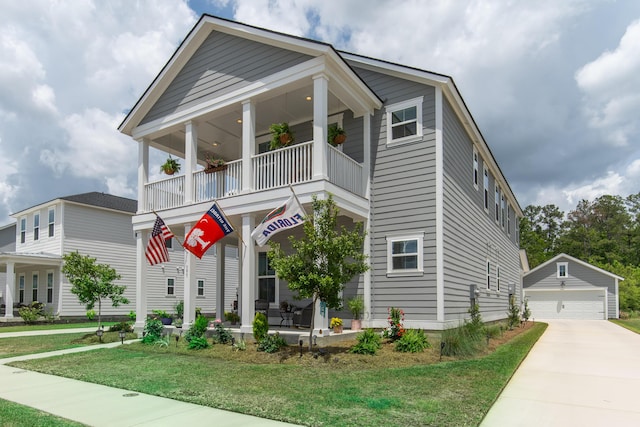 397 Woodgate Way, Summerville, SC 29485 - view of front of home featuring a front yard, a garage, an outbuilding, and a balcony
