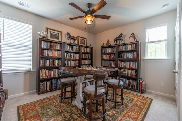 397 Woodgate Way, Summerville, SC 29485 - sitting room featuring a ceiling fan, carpet flooring, visible vents, and wall of books