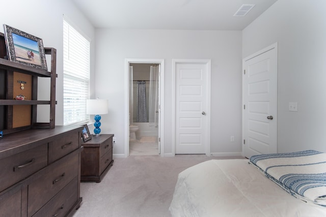 397 Woodgate Way, Summerville, SC 29485 - bedroom with light colored carpet, ensuite bath, visible vents, and baseboards
