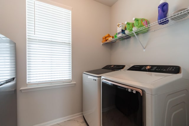 397 Woodgate Way, Summerville, SC 29485 - washroom with baseboards, marble finish floor, washing machine and dryer, and laundry area