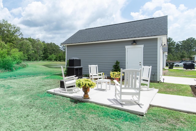 397 Woodgate Way, Summerville, SC 29485 - back of house featuring a shingled roof, a patio, and a lawn