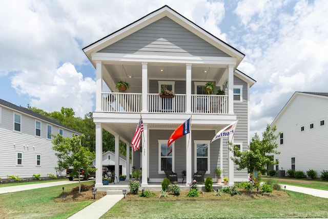 397 Woodgate Way, Summerville, SC 29485 - view of front of house with covered porch, a front yard, and a balcony