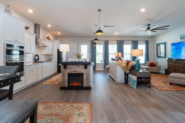 397 Woodgate Way, Summerville, SC 29485 - living room featuring baseboards, ceiling fan, visible vents, and wood finished floors