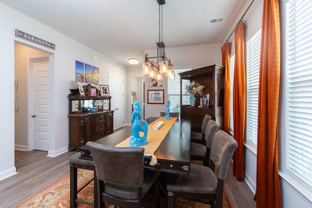 397 Woodgate Way, Summerville, SC 29485 - dining space featuring a chandelier, visible vents, wood finished floors, and baseboards