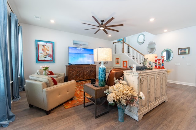 397 Woodgate Way, Summerville, SC 29485 - living area with visible vents, wood finished floors, ceiling fan, and stairs