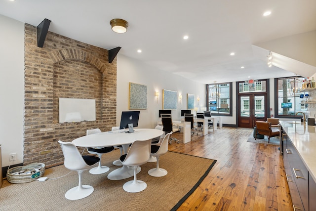 dining room featuring light wood-style floors, recessed lighting, and french doors