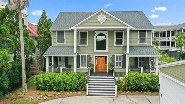 view of front of home with a shingled roof