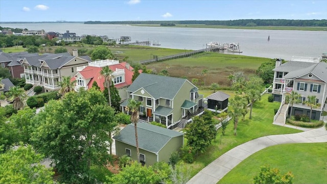 drone / aerial view with a residential view and a water view