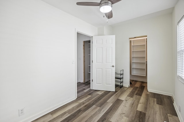 634 Rutledge Ave, Charleston, SC 29403 - unfurnished bedroom featuring wood finished floors, a walk in closet, baseboards, and a closet