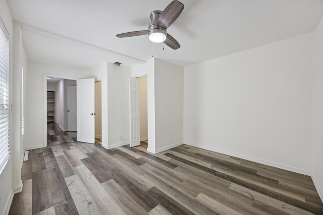 634 Rutledge Ave, Charleston, SC 29403 - unfurnished bedroom with wood finished floors, baseboards, and a ceiling fan