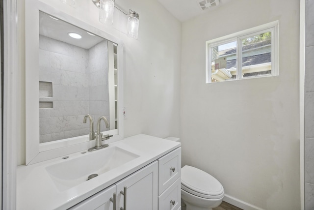 634 Rutledge Ave, Charleston, SC 29403 - bathroom with toilet, vanity, and baseboards
