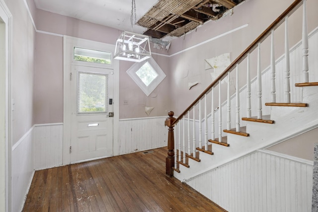 634 Rutledge Ave, Charleston, SC 29403 - entryway featuring hardwood / wood-style floors, stairway, a wainscoted wall, and a chandelier