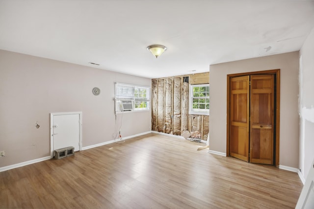 634 Rutledge Ave, Charleston, SC 29403 - unfurnished bedroom with light wood-type flooring, baseboards, and cooling unit