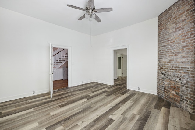 634 Rutledge Ave, Charleston, SC 29403 - unfurnished room with a ceiling fan, stairway, wood finished floors, and baseboards