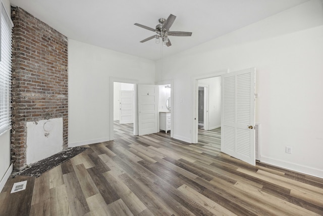 634 Rutledge Ave, Charleston, SC 29403 - unfurnished living room featuring a ceiling fan, wood finished floors, and baseboards