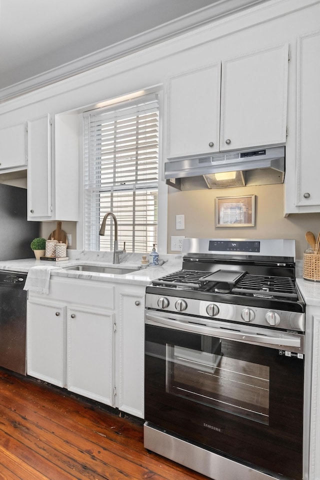 51/2 Kracke St Unit A, Charleston, SC 29403 - kitchen featuring gas range, under cabinet range hood, dishwasher, light countertops, and white cabinetry