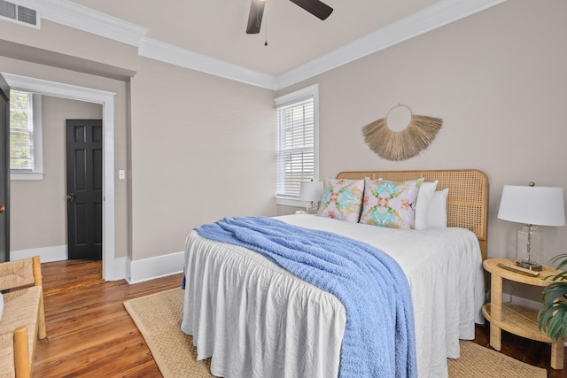 51/2 Kracke St Unit A, Charleston, SC 29403 - bedroom featuring wood finished floors, ornamental molding, baseboards, and a ceiling fan