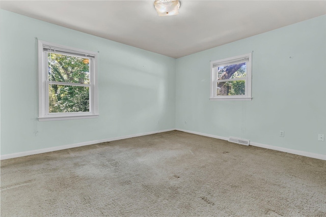 1143 Winborn Dr, Charleston, SC 29412 - carpeted spare room featuring visible vents, baseboards, and a wealth of natural light