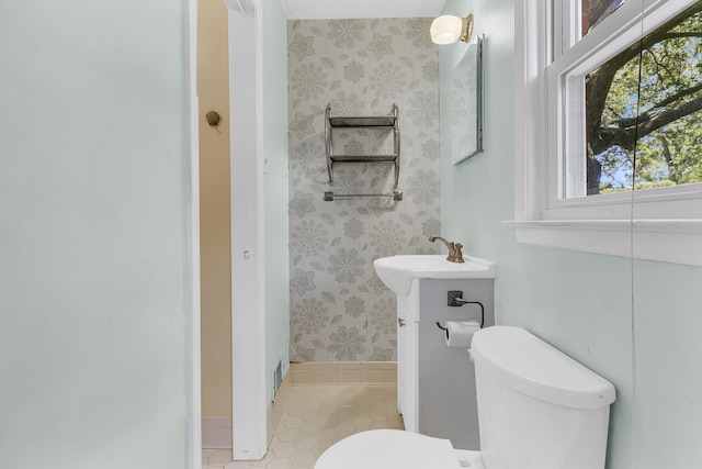 1143 Winborn Dr, Charleston, SC 29412 - bathroom featuring tile patterned flooring, baseboards, vanity, toilet, and wallpapered walls