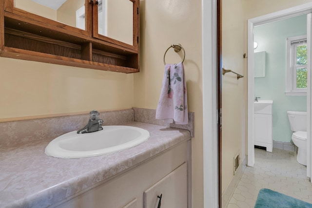 1143 Winborn Dr, Charleston, SC 29412 - bathroom with vanity, tile patterned flooring, toilet, and visible vents