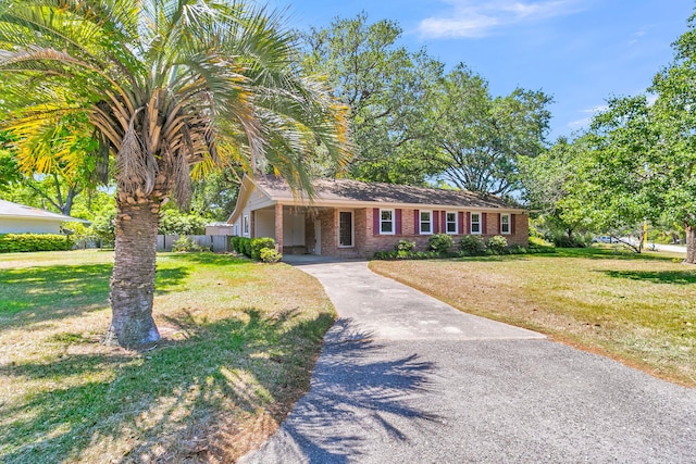 1143 Winborn Dr, Charleston, SC 29412 - single story home with brick siding, a front lawn, an attached carport, and concrete driveway