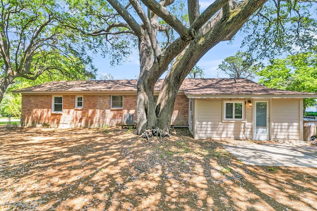 1143 Winborn Dr, Charleston, SC 29412 - back of house featuring central AC unit and brick siding