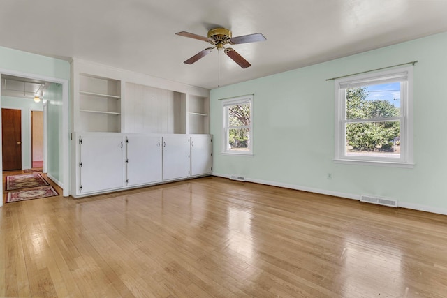 1143 Winborn Dr, Charleston, SC 29412 - spare room with built in features, a ceiling fan, light wood finished floors, and visible vents