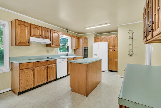 1143 Winborn Dr, Charleston, SC 29412 - kitchen featuring a center island, a sink, black appliances, light floors, and under cabinet range hood