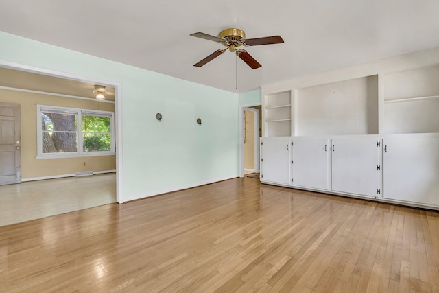 1143 Winborn Dr, Charleston, SC 29412 - unfurnished living room featuring baseboards, a ceiling fan, light wood finished floors, and built in shelves