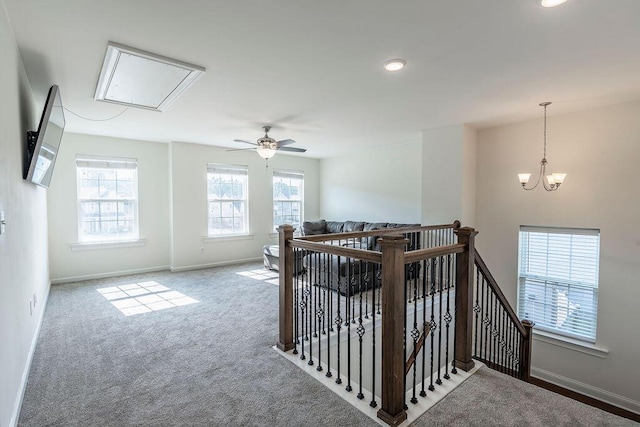 interior space with an inviting chandelier and carpet floors