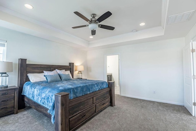 bedroom with a raised ceiling, ceiling fan, light carpet, and crown molding