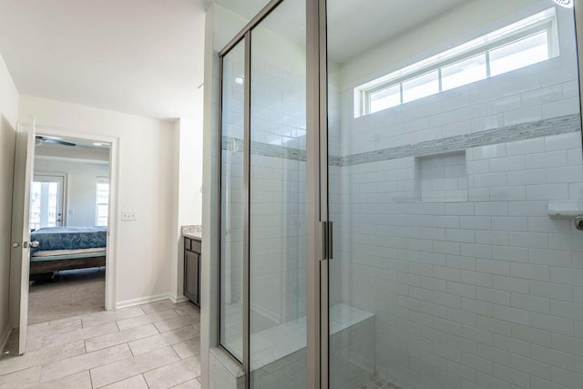 bathroom with vanity and a shower with shower door